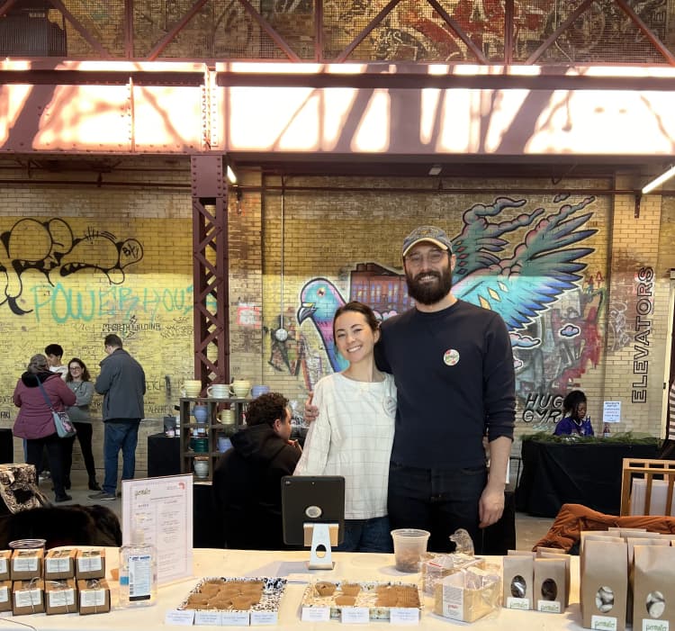 josh and erin at a winter market