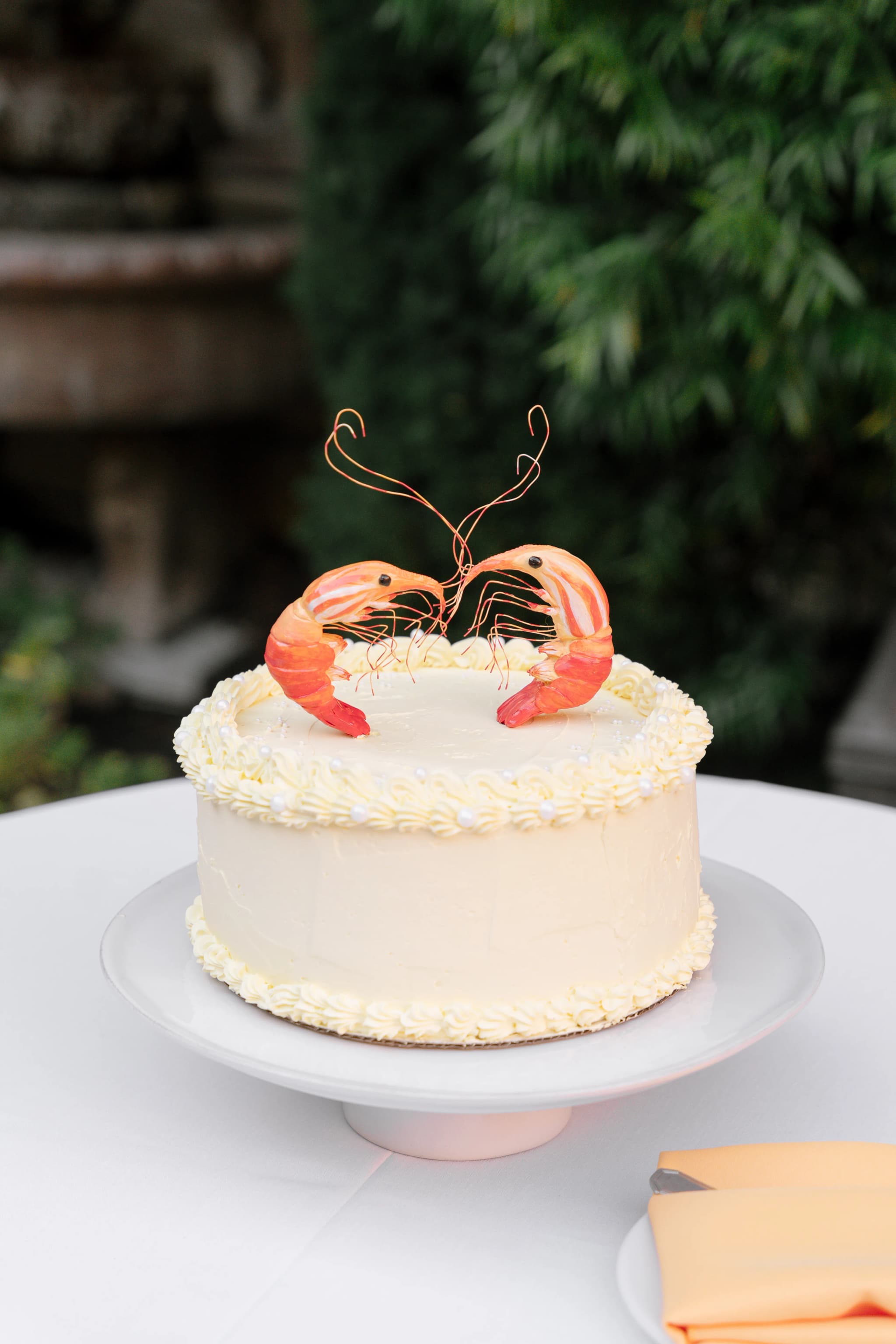wedding cake with paper shrimp toppers 3