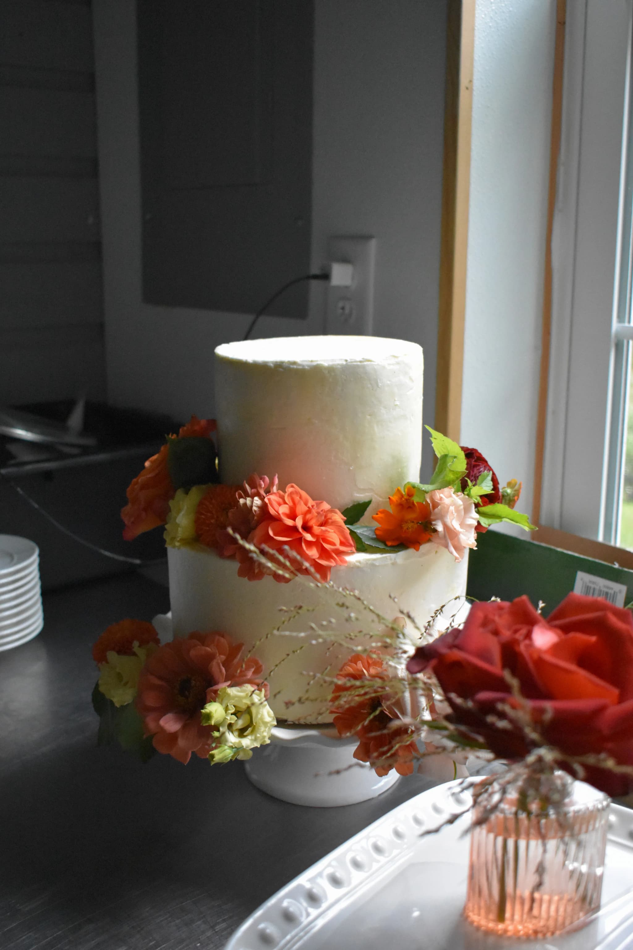 two tiered cake with flower arrangement